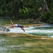Travelers exploring authentic Belize adventures in the Cayo District surrounded by nature and local culture
