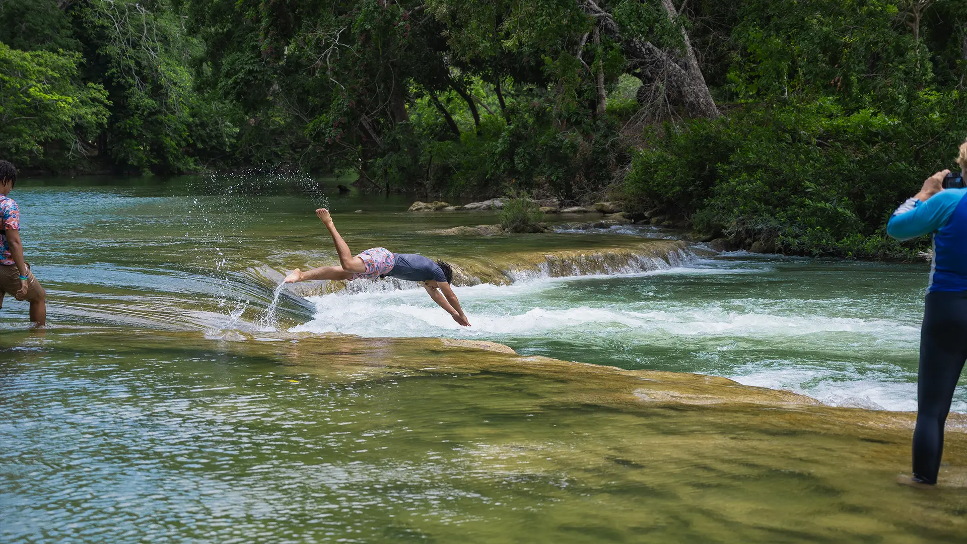 Travelers exploring authentic Belize adventures in the Cayo District surrounded by nature and local culture